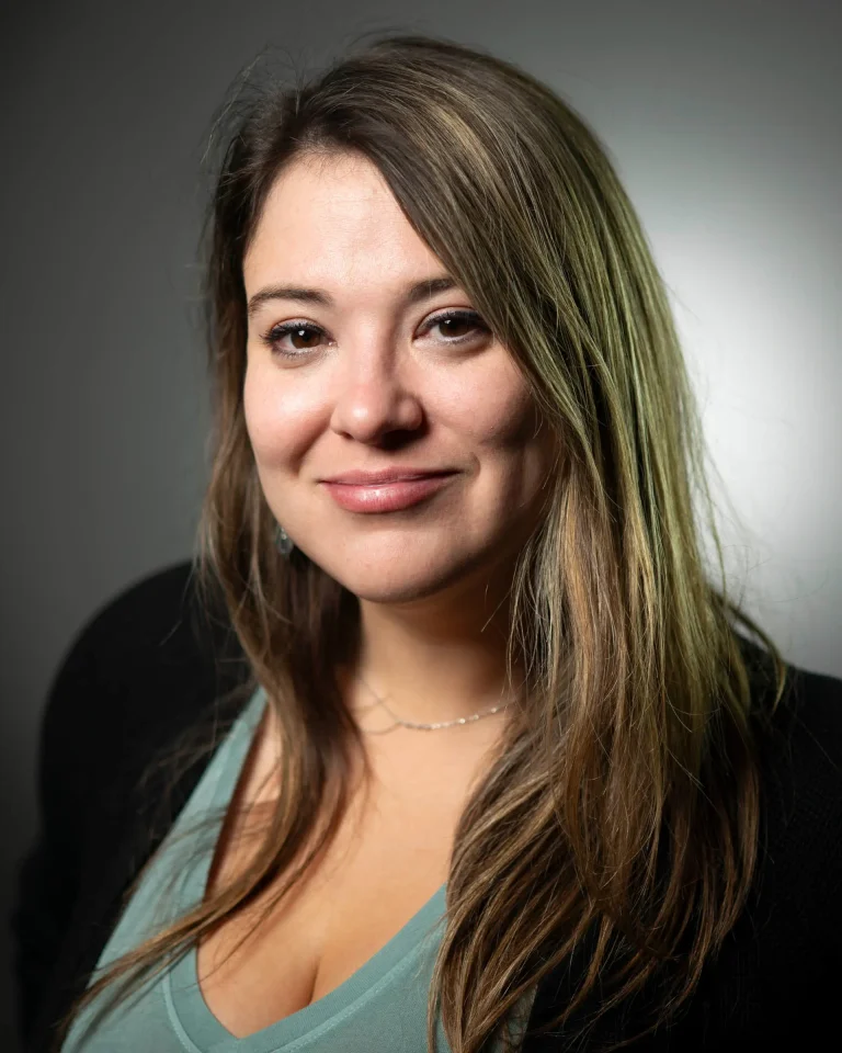 Woman with long brown hair, smiling